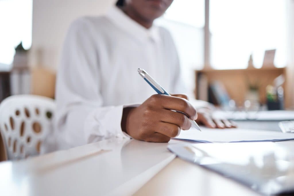 Business woman completing paperwork