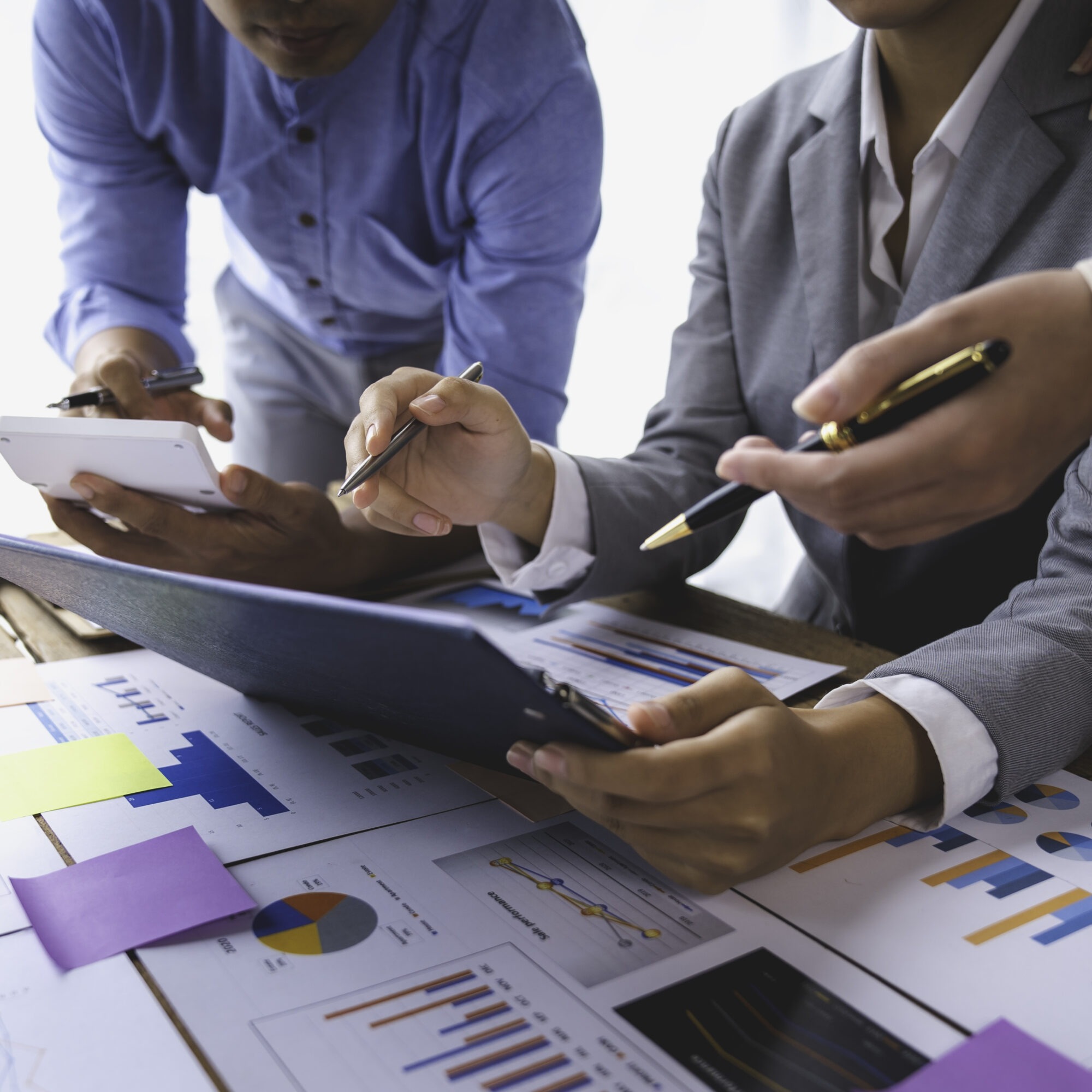 financial-analyst-analyzes-businessman-investment-2023-06-15-04-39-47-utc Financial analyst analyzes businessman investment consultant analyzing company financial report balance sheet statement working with documents graphs. Concept picture for stock market, office, tax