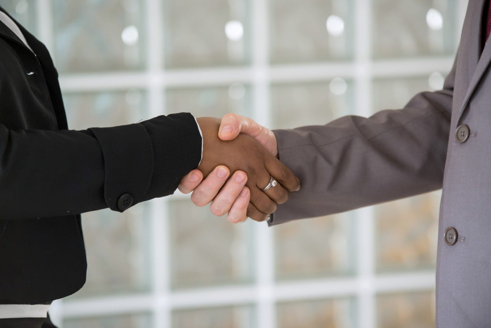 an-interracial-handshake-2024-10-17-04-10-02-utc