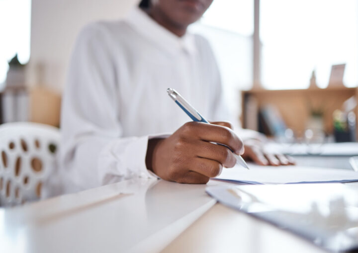 Business woman completing paperwork